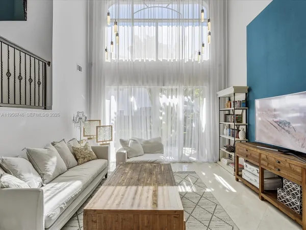 a living room with furniture and a window