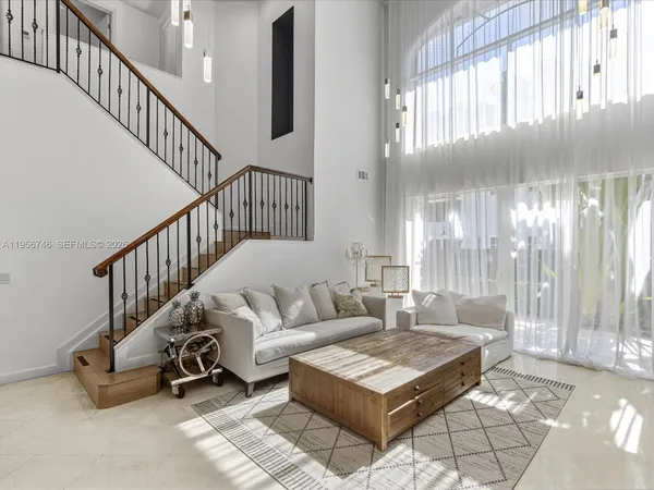 a kitchen with stainless steel appliances a stove and cabinets