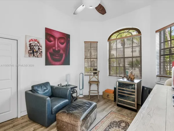 a bedroom with a bed and a couch