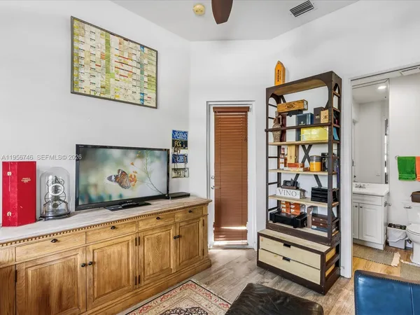 a bedroom with a bed and a chair