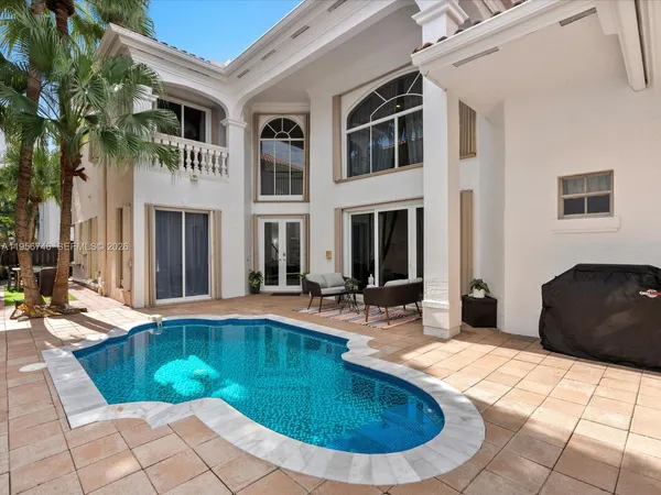 a view of a house with sitting area and furniture