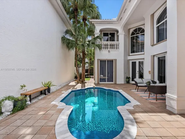 a view of a swimming pool with a lounge chair