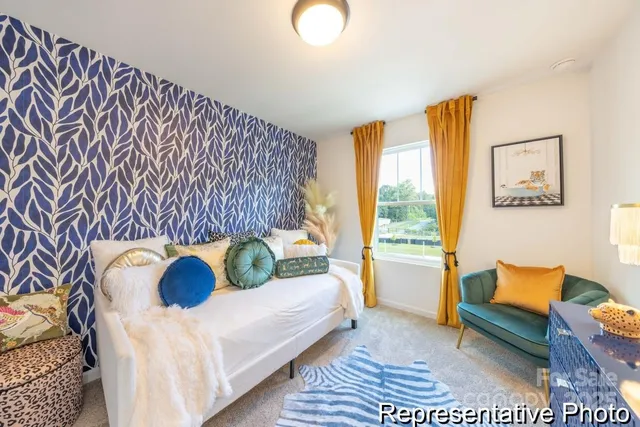 a bedroom with a bed and a couch