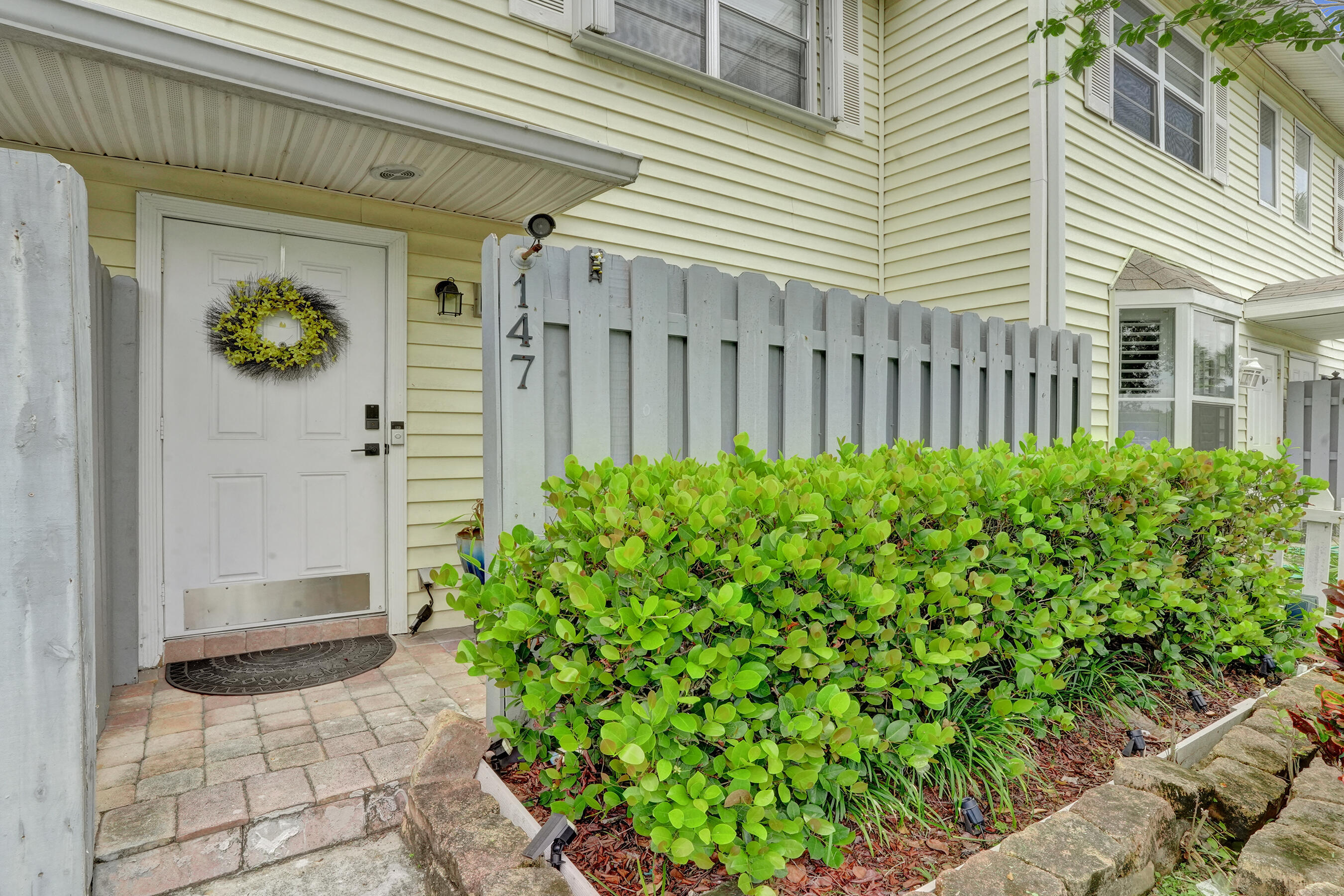 147 Southwest 3rd Street Pompano Beach, FL 33060 - Photo 27 of 29 a view of a house with a flower garden