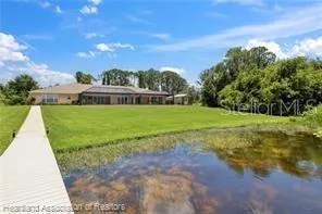 an aerial view of a house with a swimming pool