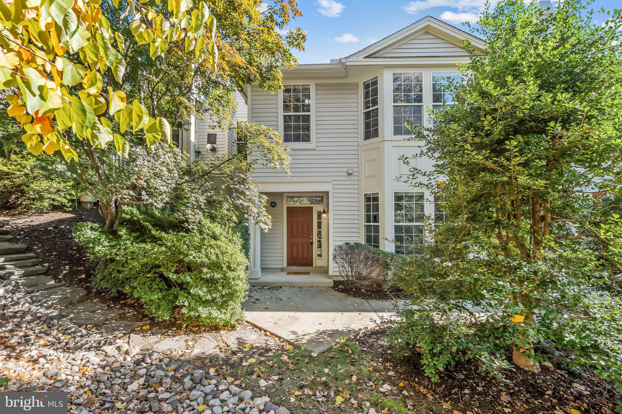 11408 Gate Hill Place, Unit 113 Reston, VA 20194 - Photo 1 of 30 front view of a house with a yard