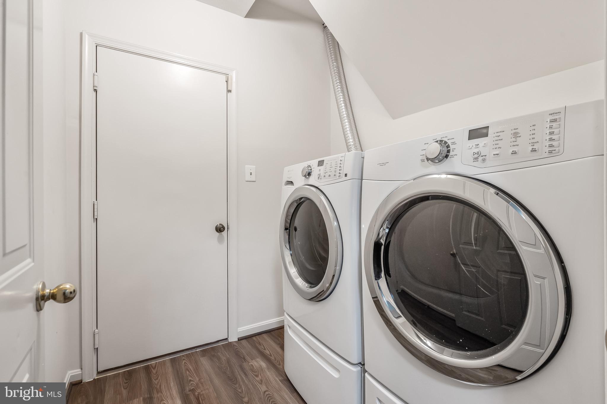 11408 Gate Hill Place, Unit 113 Reston, VA 20194 - Photo 19 of 30 a utility room with dryer and washer