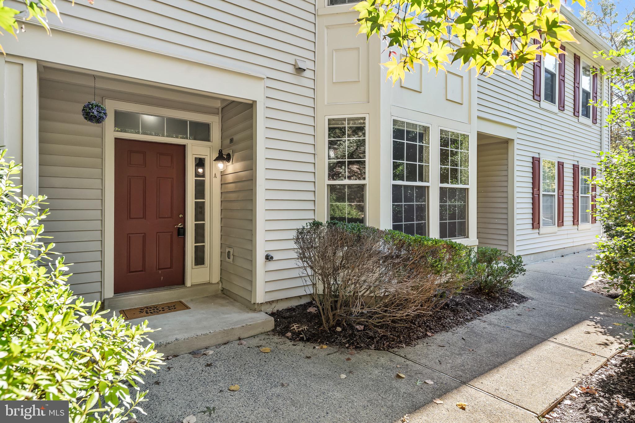 11408 Gate Hill Place, Unit 113 Reston, VA 20194 - Photo 2 of 30 a view of a house with backyard and garden