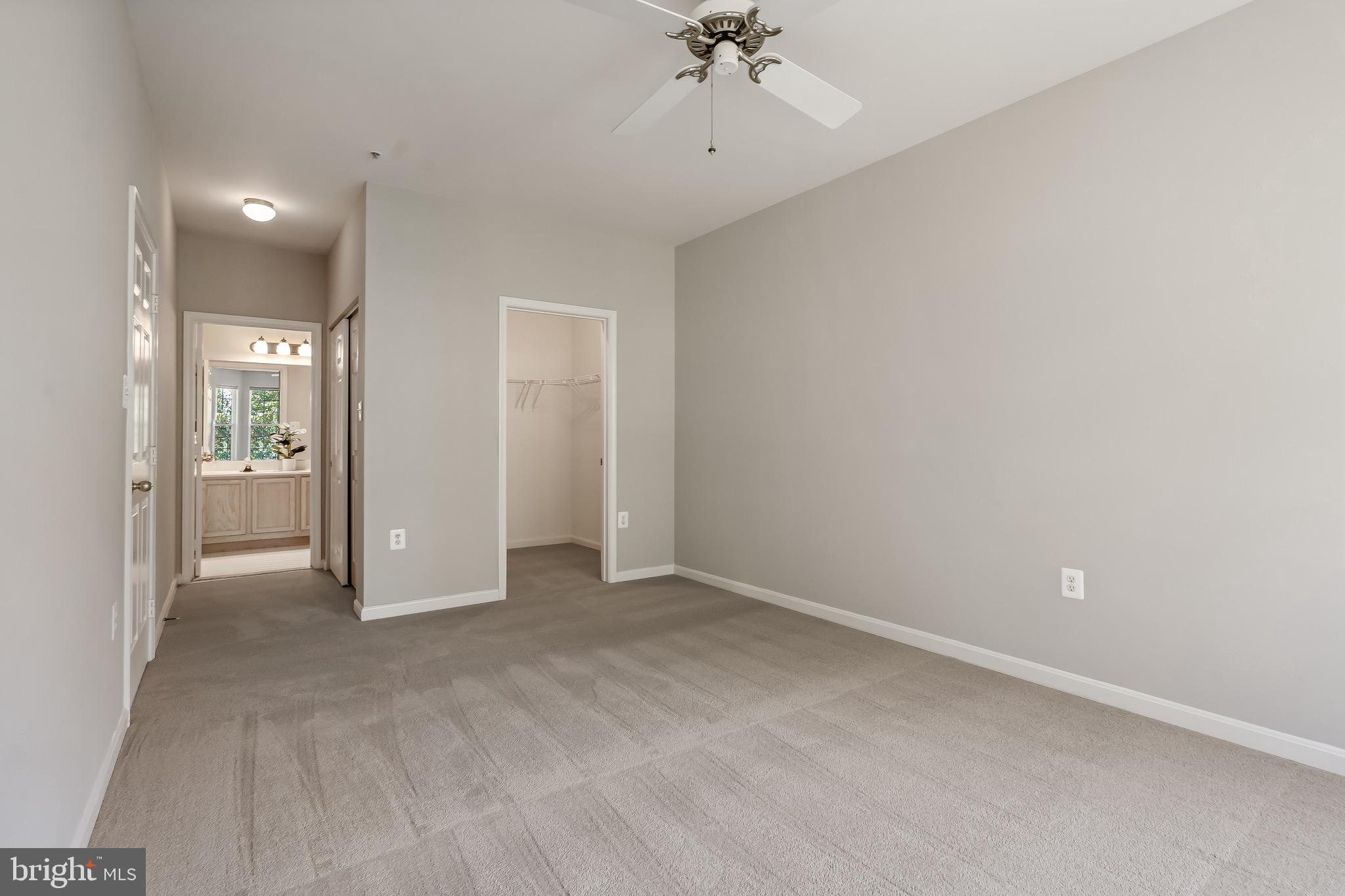 11408 Gate Hill Place, Unit 113 Reston, VA 20194 - Photo 23 of 30 an empty room with fan
