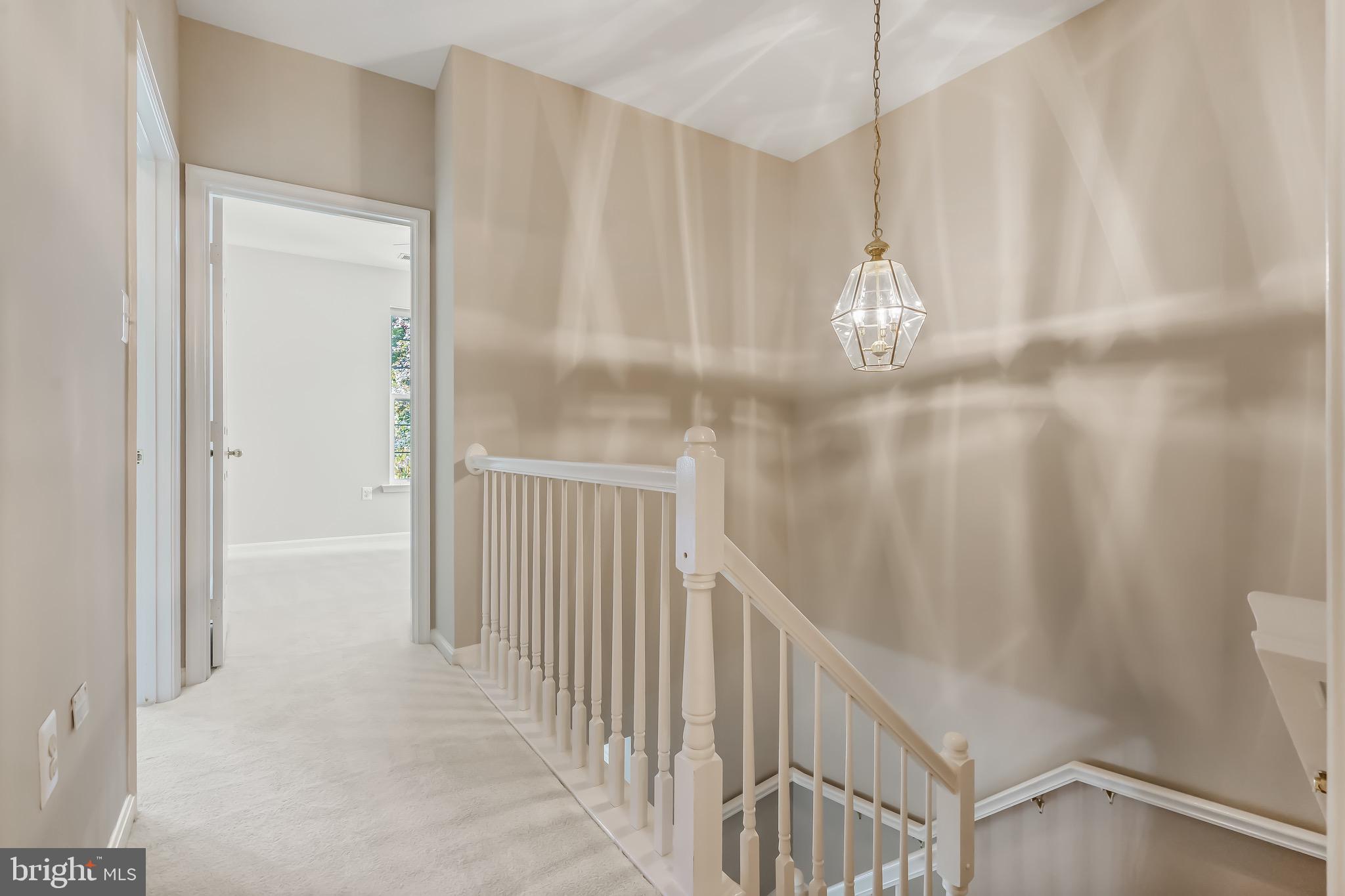 11408 Gate Hill Place, Unit 113 Reston, VA 20194 - Photo 26 of 30 a view of a hallway with windows