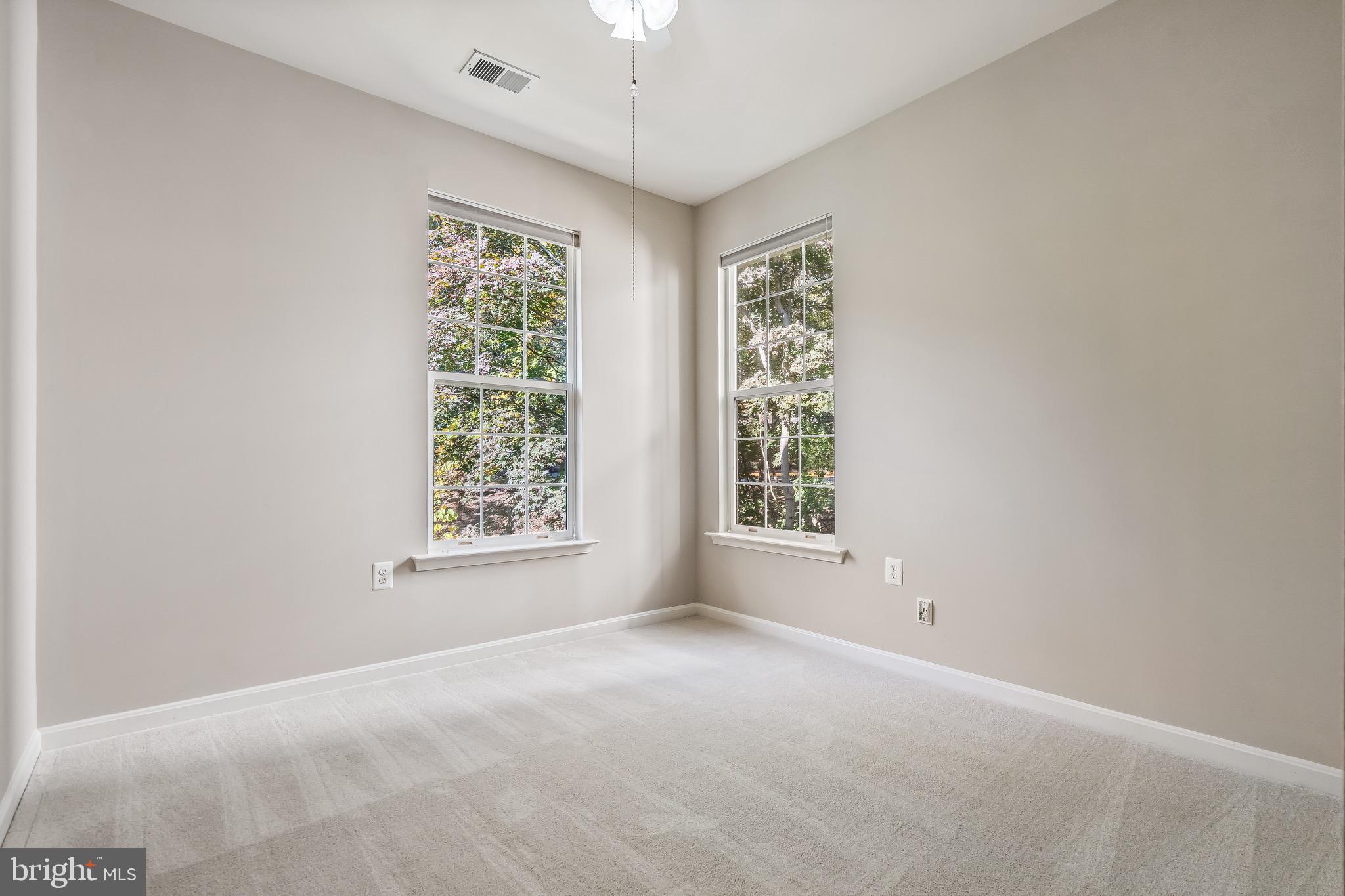 11408 Gate Hill Place, Unit 113 Reston, VA 20194 - Photo 28 of 30 a view of an empty room with a window