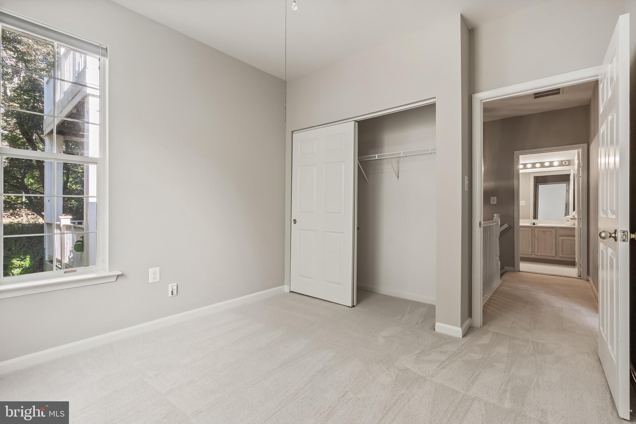 11408 Gate Hill Place, Unit 113 Reston, VA 20194 - Photo 29 of 30 a view of an empty room with a window
