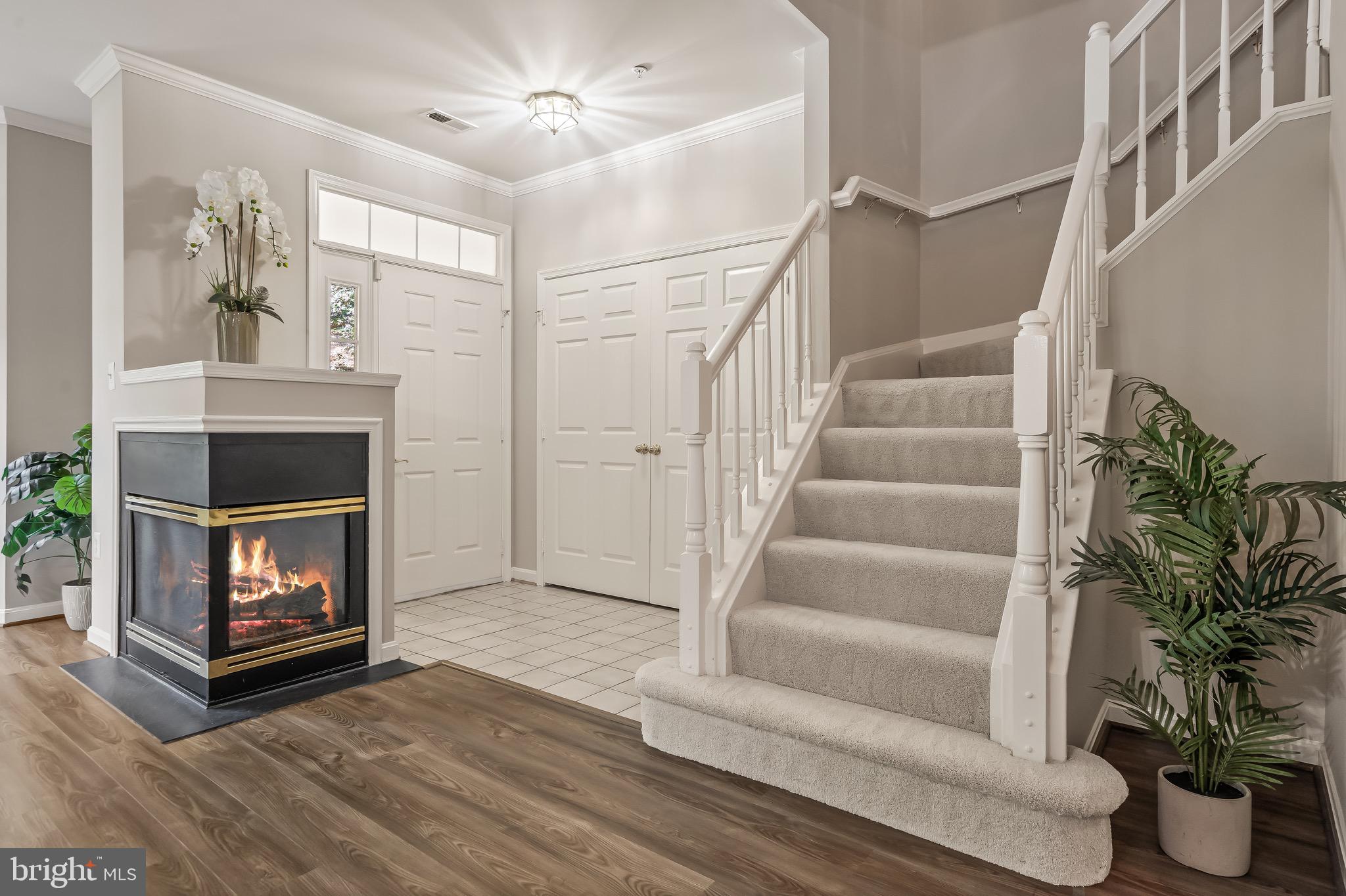11408 Gate Hill Place, Unit 113 Reston, VA 20194 - Photo 6 of 30 a view of a livingroom with furniture and a fireplace