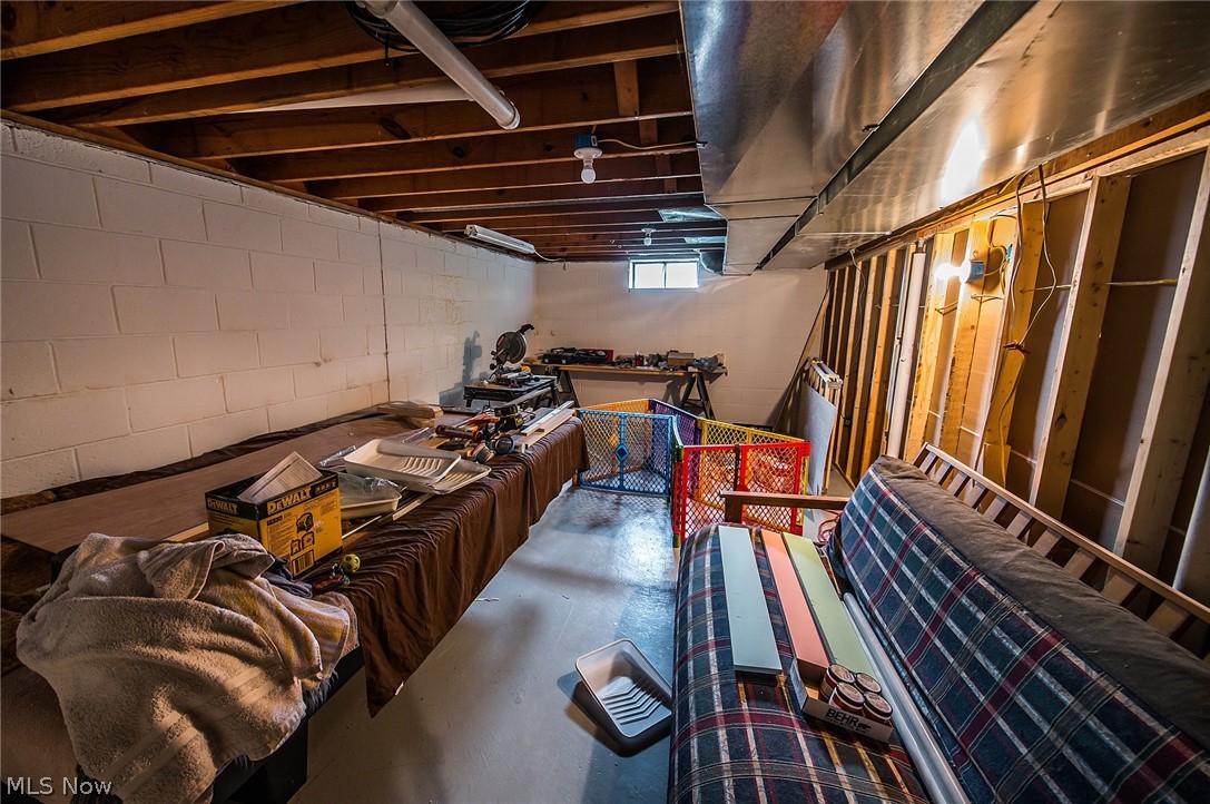 10744 Johnnycake Ridge Road Painesville, OH 44077 - Photo 26 of 31 Half of the basement can be a work area or converted to an extra office or game room
