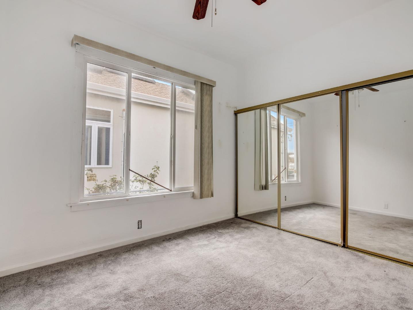 1164 Ocean Avenue Oakland, CA 94608 - Photo 11 of 32 an empty room with windows