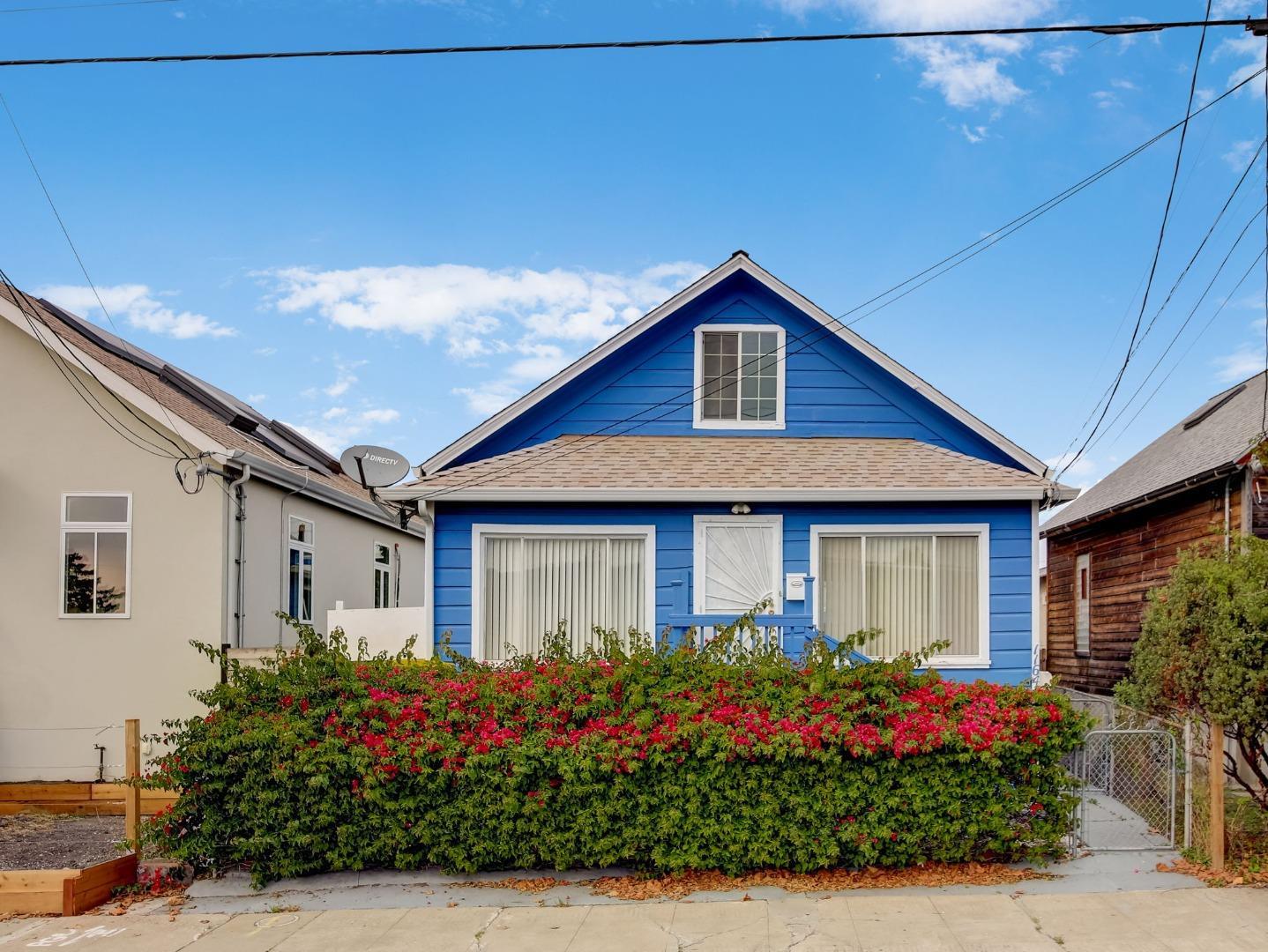 1164 Ocean Avenue Oakland, CA 94608 - Photo 23 of 32 a front view of a house with a garden