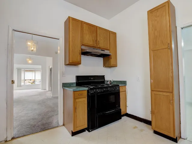 a kitchen with stainless steel appliances granite countertop a stove and a refrigerator