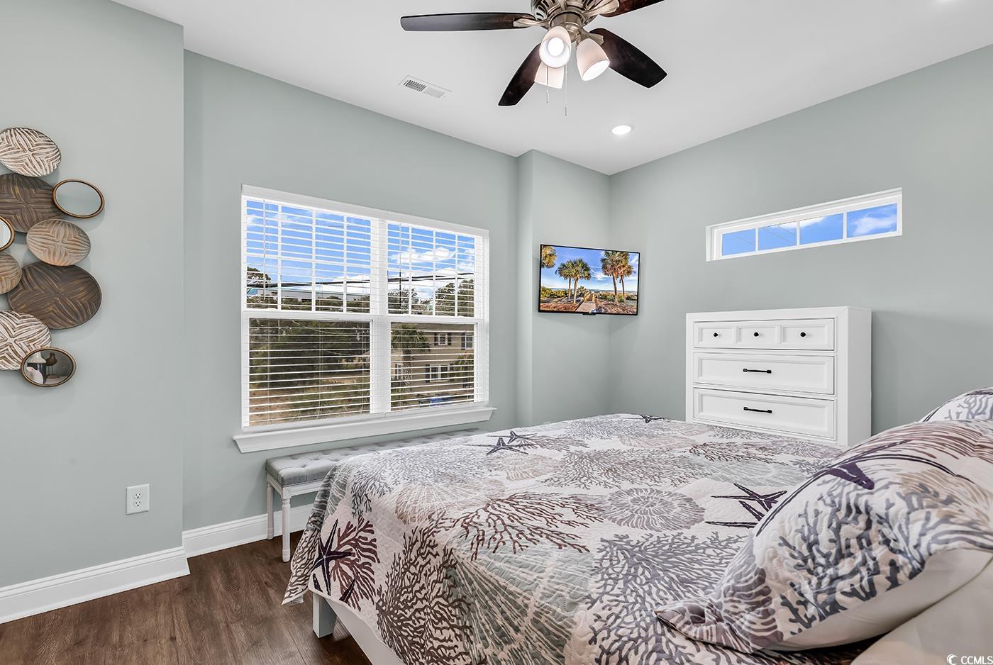 306 6th Avenue North Myrtle Beach, SC 29577 - Photo 12 of 28 Bedroom with dark wood-type flooring and a ceiling fan
