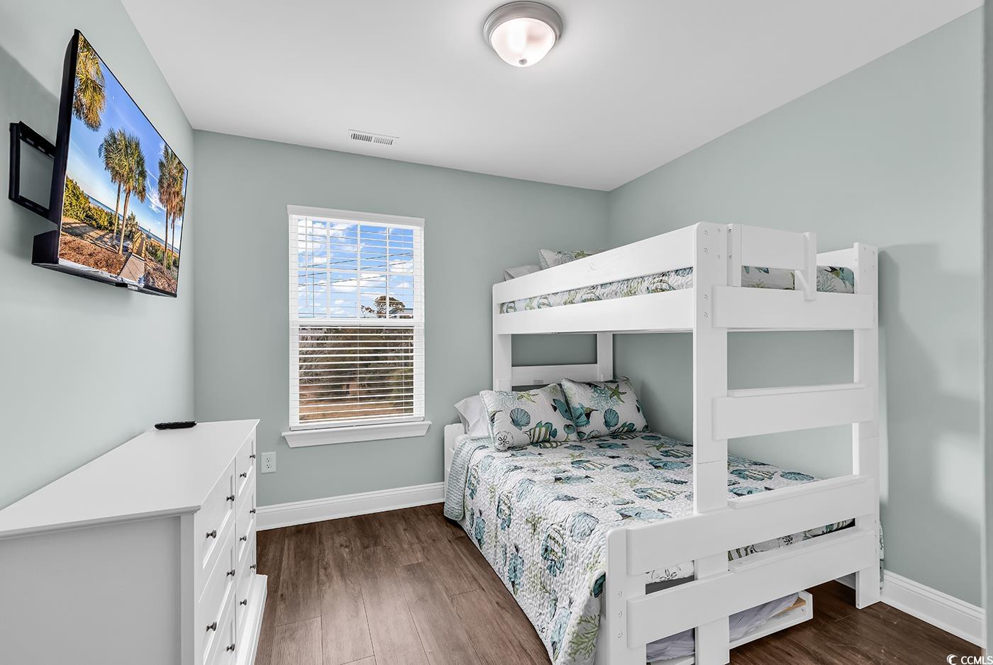 306 6th Avenue North Myrtle Beach, SC 29577 - Photo 17 of 28 Bedroom featuring dark wood finished floors