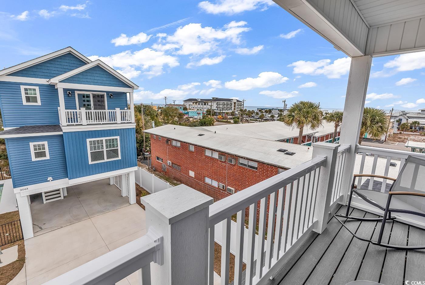 306 6th Avenue North Myrtle Beach, SC 29577 - Photo 23 of 28 Balcony with a sunroom