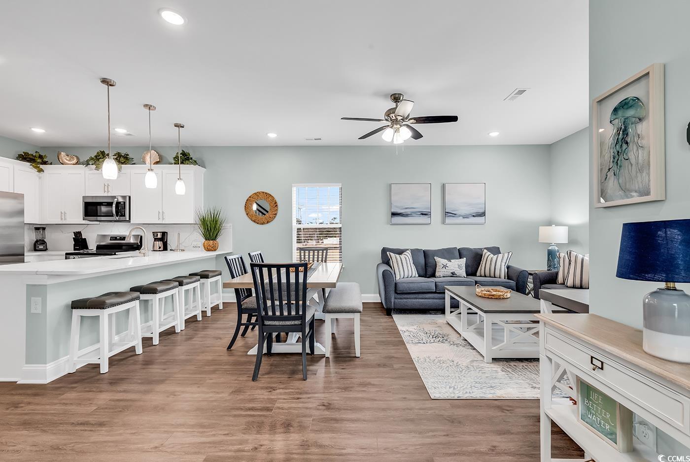 306 6th Avenue North Myrtle Beach, SC 29577 - Photo 4 of 28 Living room with light wood-type flooring, recessed lighting, and a ceiling fan