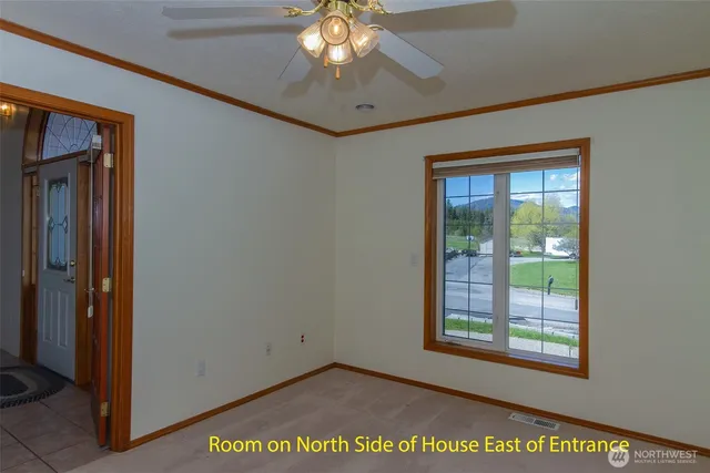 an empty room with windows and closet