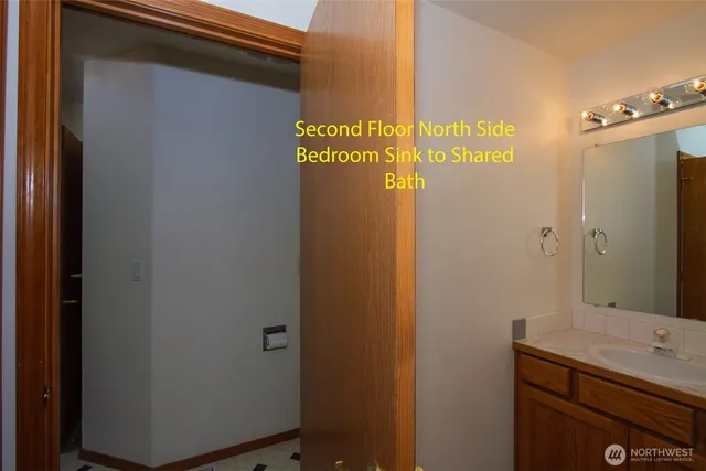 a bathroom with a shower and a sink