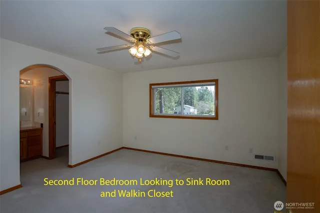 a view of a hallway with a chandelier