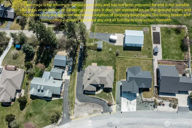 an aerial view of multiple houses with yard