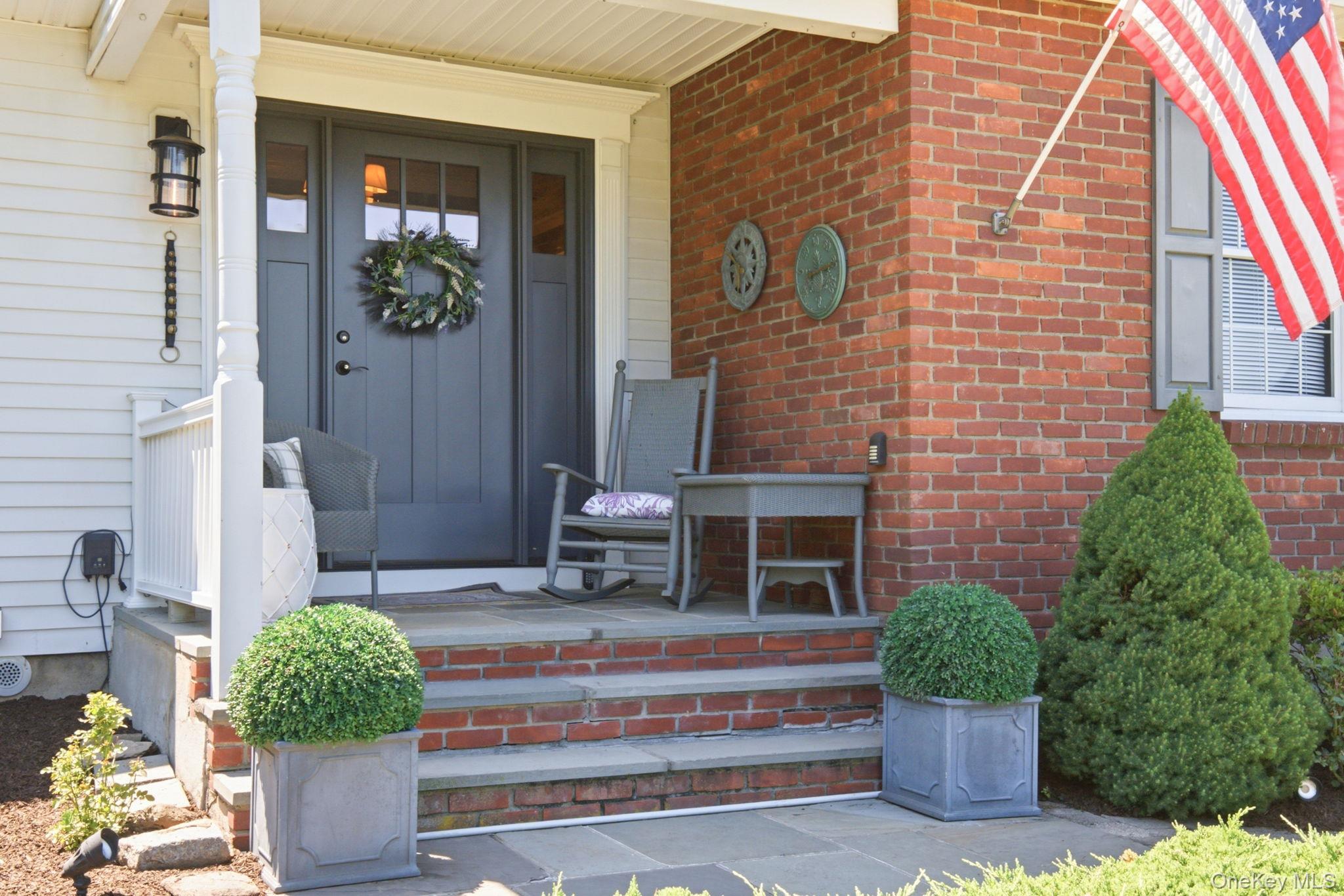 32 Bedell Road Katonah, NY 10536 - Photo 2 of 49 Brick and slate detailing give the front porch its classic New England welcome.
