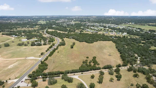 an aerial view of residential building and ocean