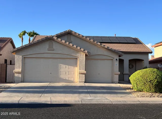 a front view of a house with a garage