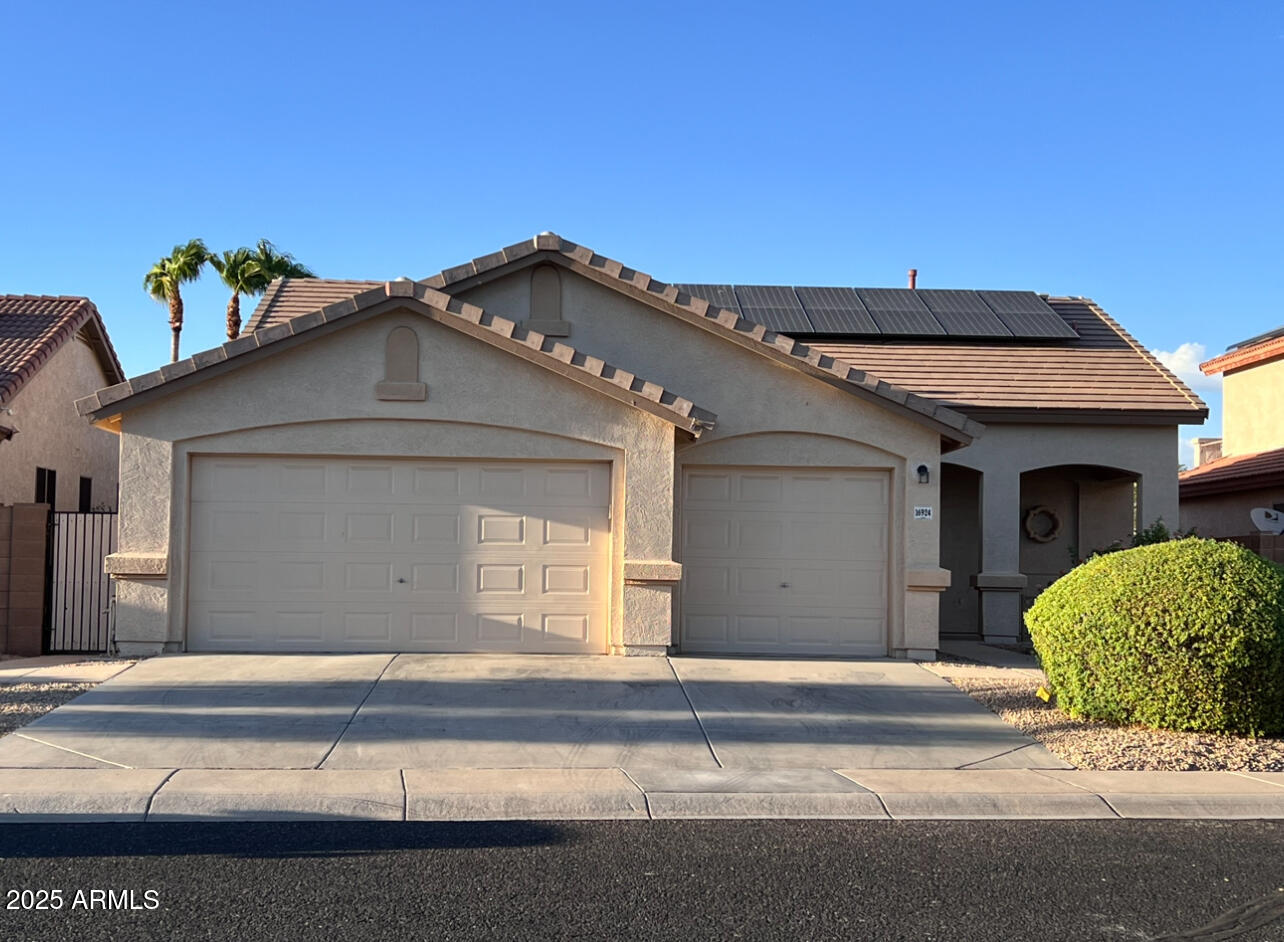 a front view of a house with a garage