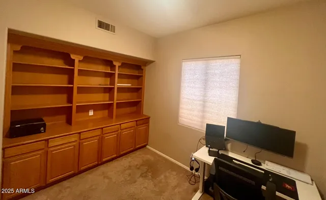 a room with furniture and flat screen tv