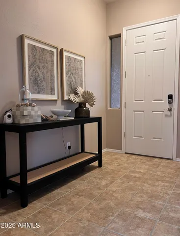 a view of an entryway with front door