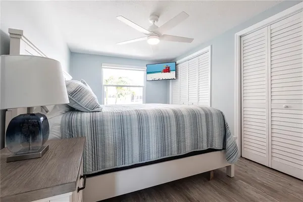a bedroom with a bed and window