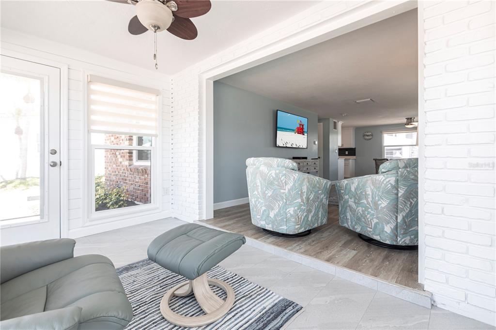 6020 Midnight Pass Road, Unit 53 Sarasota, FL 34242 - Photo 5 of 16 a living room with furniture and a large window