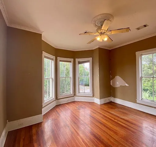 a view of hall way with furniture