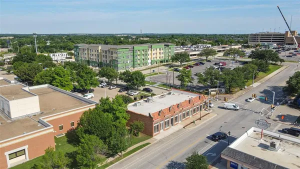an aerial view of a house with a yard lake view and mountain view