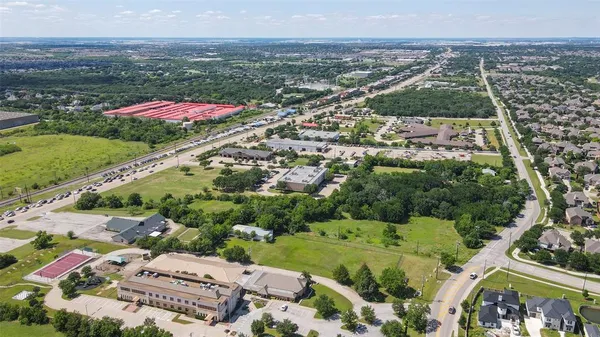 an aerial view of residential houses with outdoor space