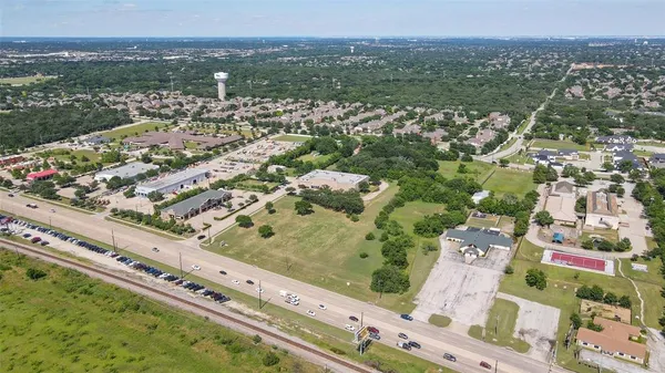 an aerial view of a residential houses and city street