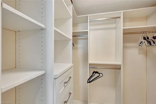 a bathroom with a shower and a sink