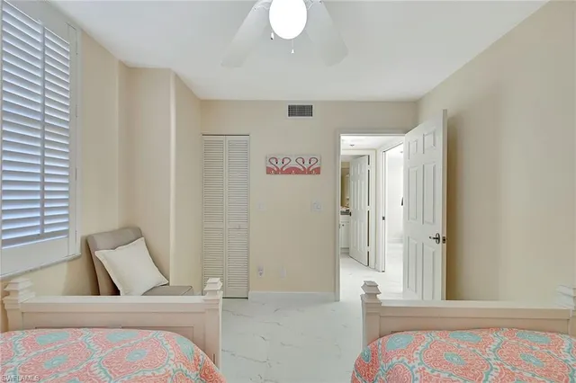 a view of bedroom with furniture and window