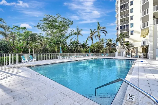 a view of a swimming pool with a patio