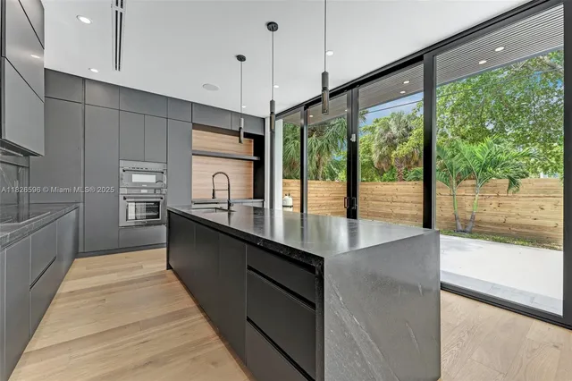 a view of an entryway with wooden floor