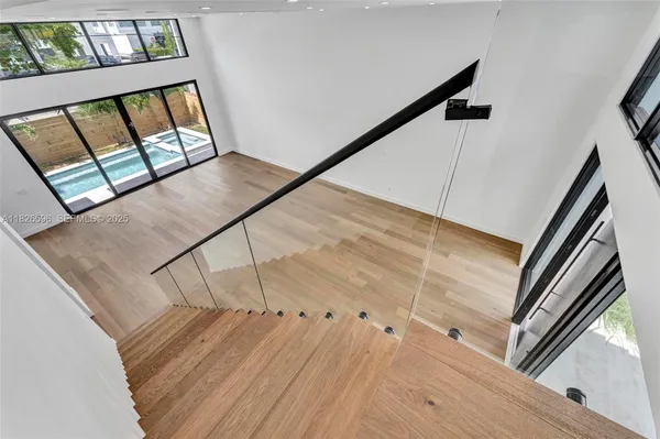 a spacious bathroom with a double vanity sink a mirror and a bathtub