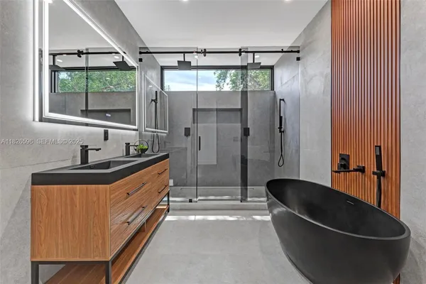a view of a room with a door and wooden fence