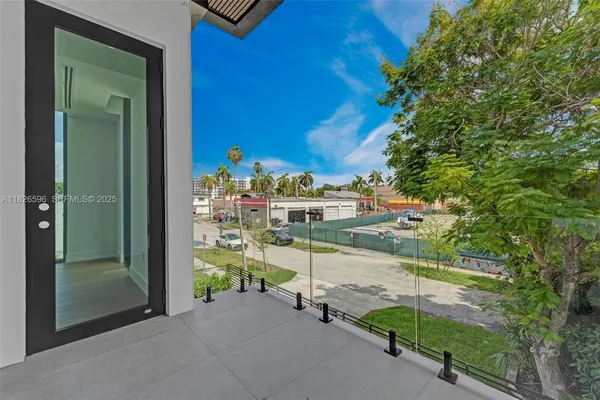 a view of room with furniture and wooden floor