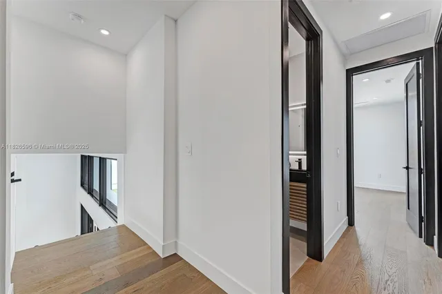 a view of a backyard with plants and a patio