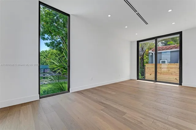 a view of a house with backyard and porch